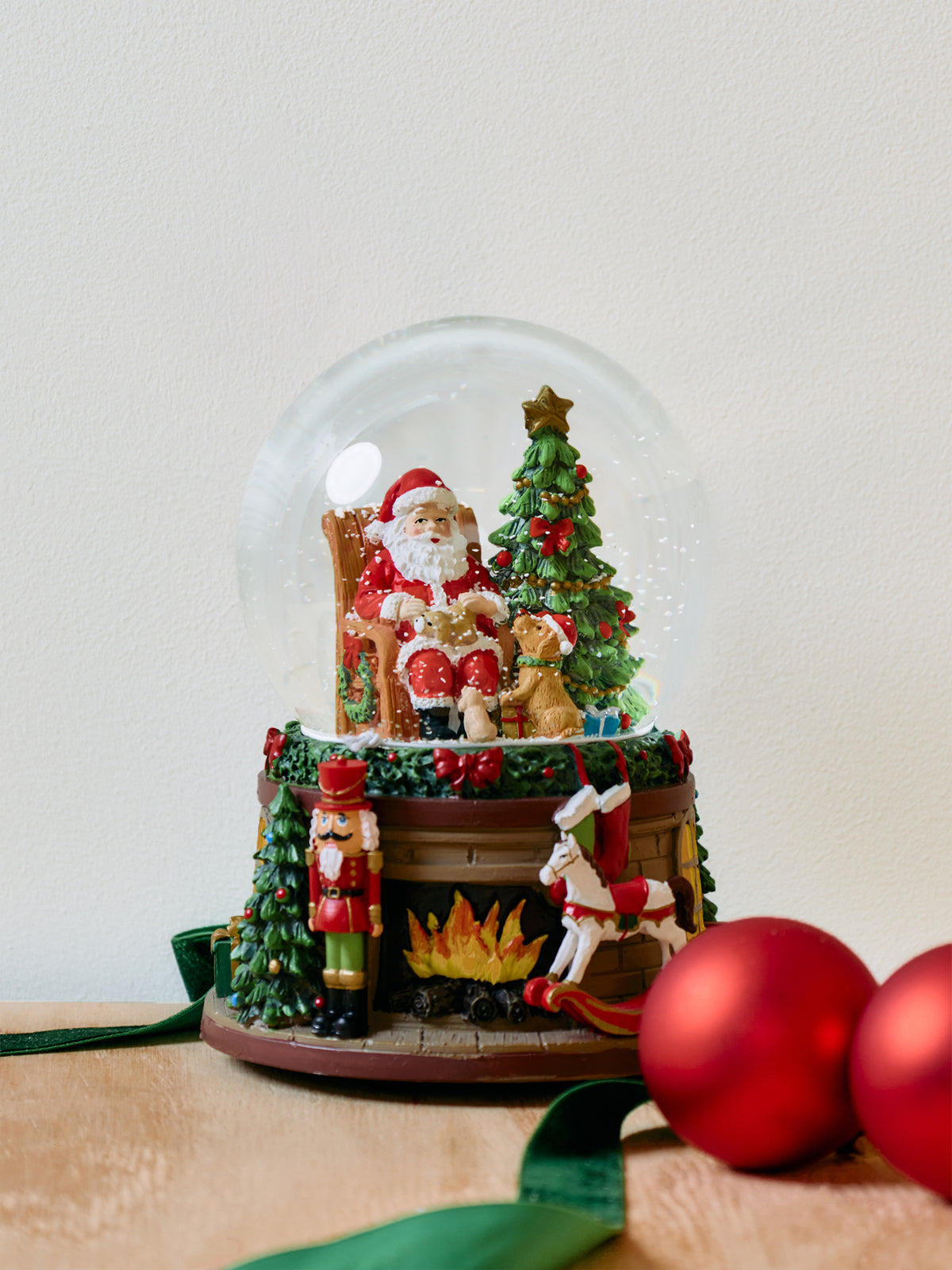 Santa In Armchair Musical Snow Globe 18cm