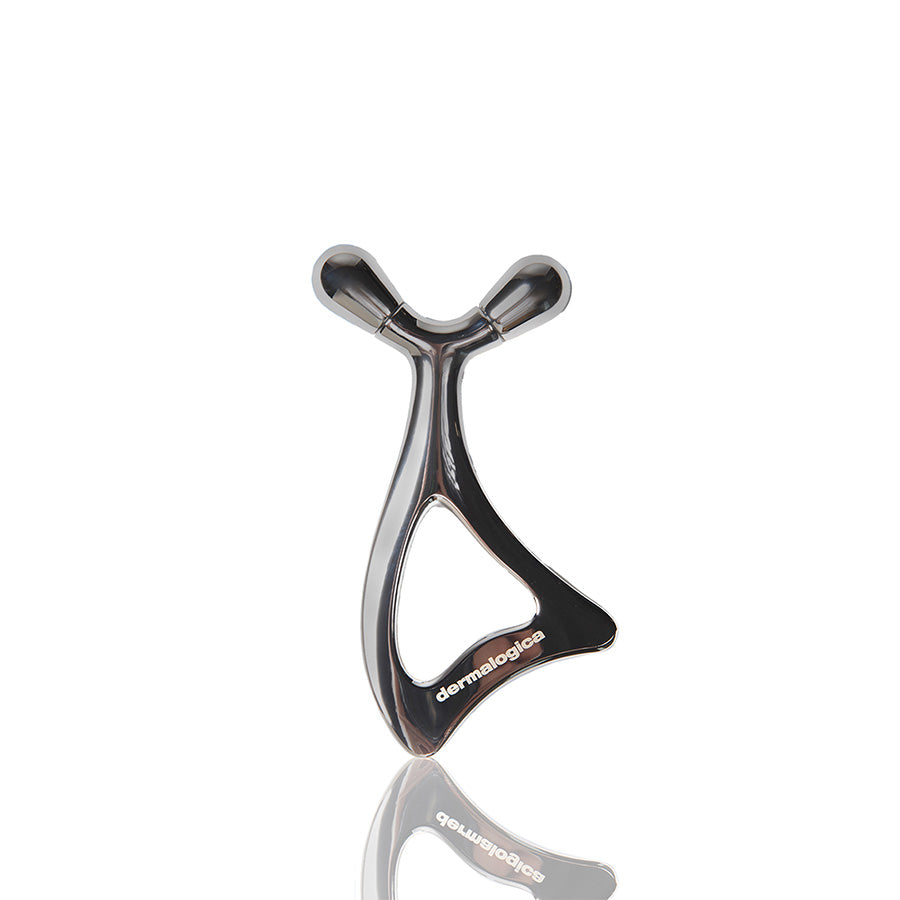 Metallic skin sculpting tool with 'Dermalogica' branding on a white background