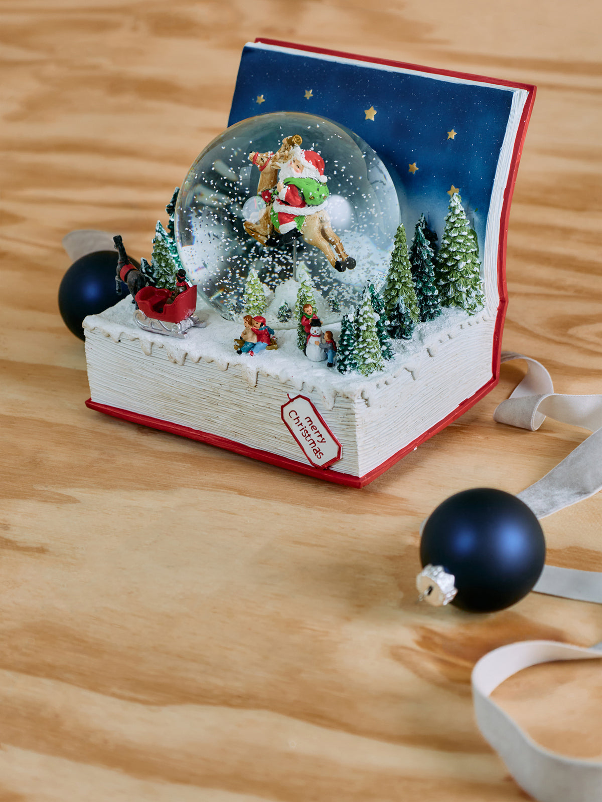 Santa In Book Musical Snow Globe 18cm