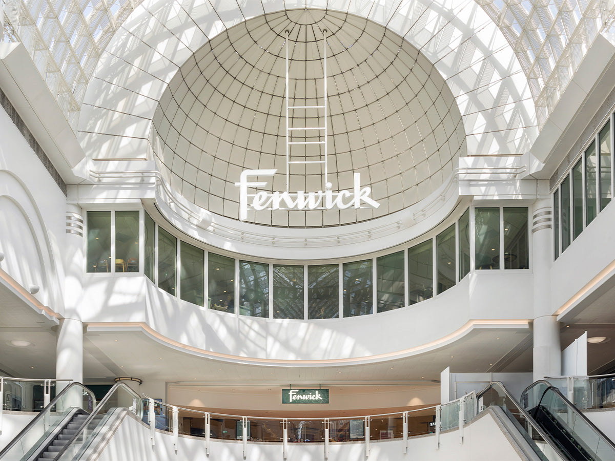 Interior of a shopping mall with a large dome ceiling and 'Ferwick' branding.