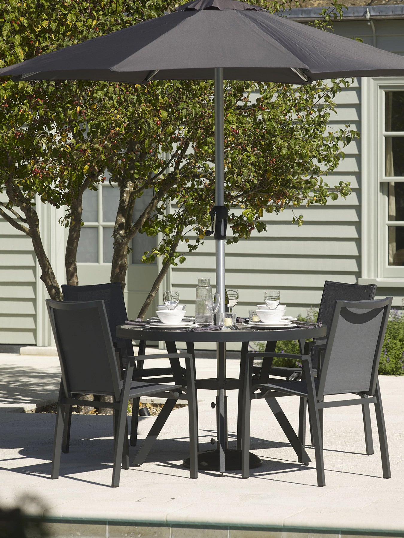 Seville Round 4 Seat Dining Table with Parasol an